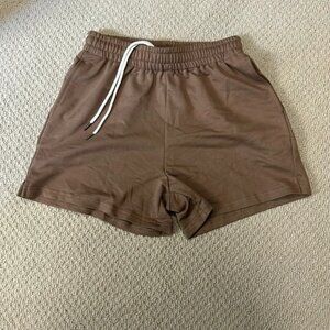 Cute, brown, athletic shorts 4”. elastic waste drawstring